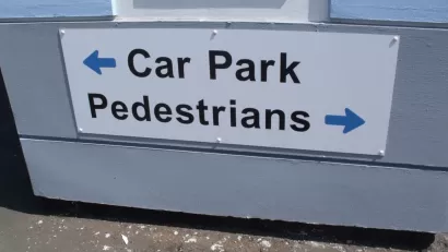 A sign for pedestrians and cars